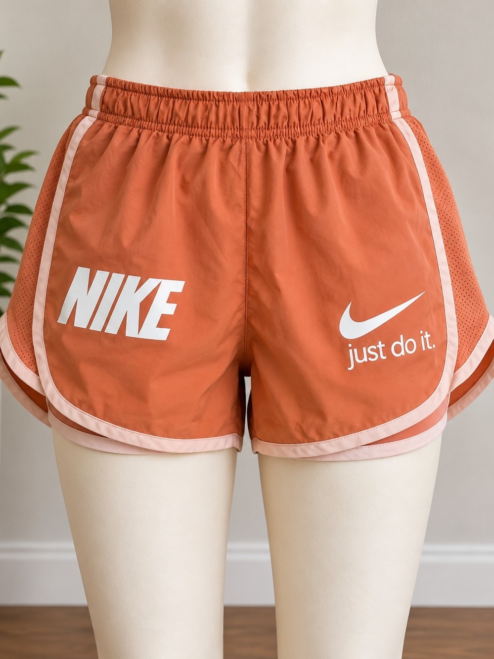 Nike Women's Rust Orange Athletic Shorts with Pale Pink Trim
